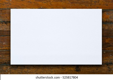 Old Textured Paper Sheet On A Dark Wood Table. Horizontal Mockup