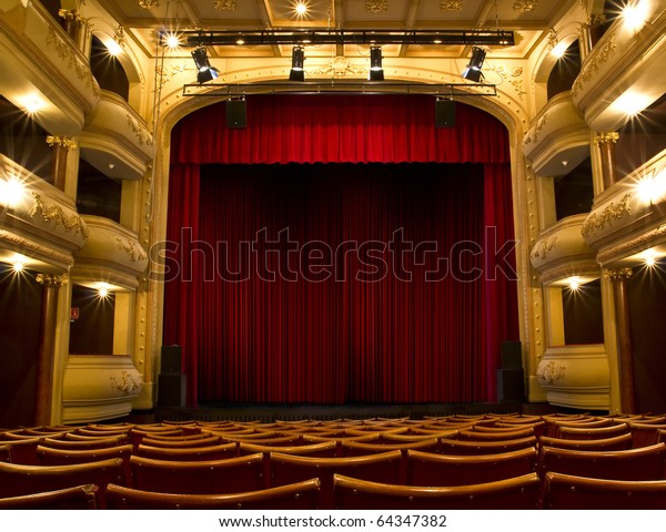 old theater stage and red\
curtain