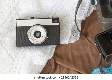 Old things folded in a retro suitcase for travel
