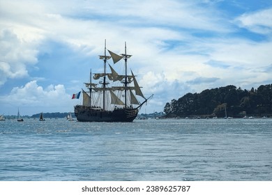 An old three-masted ship at the Ile-aux-Moines island,  beautiful seascape in the Morbihan gulf, Brittany