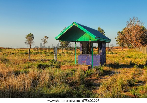 An old ticket booth at an abandoned drive in\
movie theater located in rural\
Texas