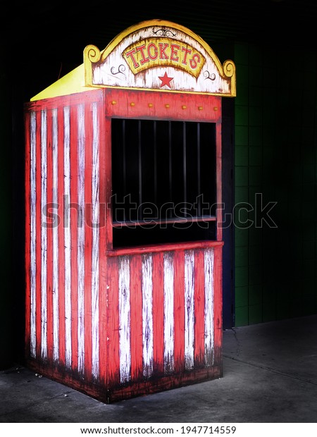 Old ticket booth at a carnival or circus selling\
ticket for rides and fun