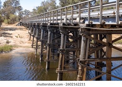 Old timber bridge structure side view horizontal format. 