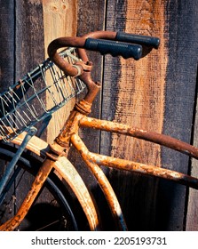 Old Time Bike Handlebars Against A Barnwood Background