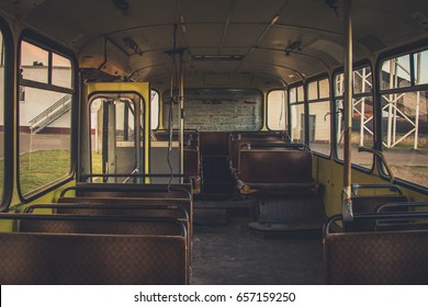 Old time bus cabin with old leather seats.