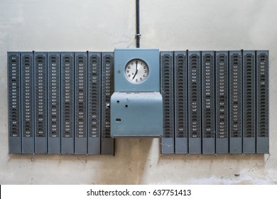 Old Time Clock In Abandoned Factory