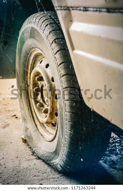 The old tire car is\
leaking.