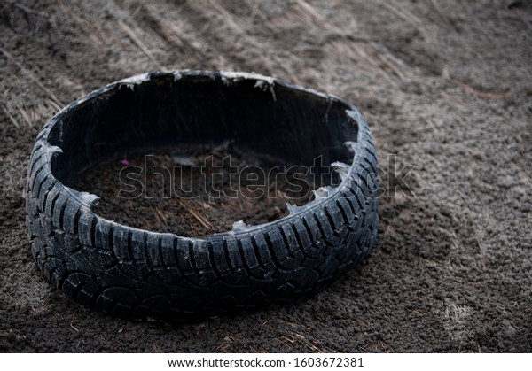Old tire pollution on the\
highway