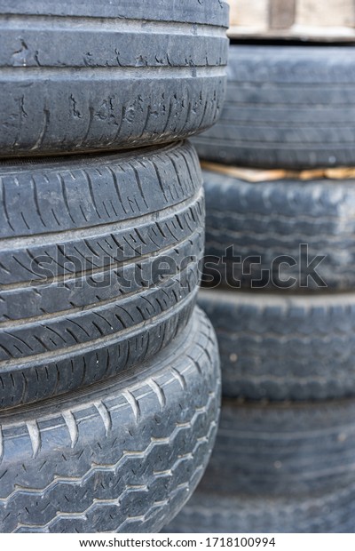 Old tires, broken tires surface damaged. A bunch of\
old tires from used cars.