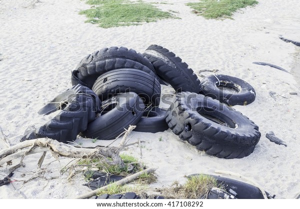 Old tires which were\
dumped on beach
