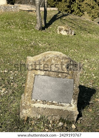 Old tombstone at the abandoned cemetery