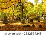 Old tombstones and monuments in the 1849 protestant Mount Hermon Cemetery seen during a golden hour fall afternoon, Quebec City, Quebec, Canada
