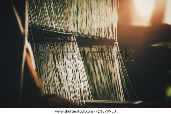 old tool to make the thread bobbin for the shuttle
of ancient loom and Cotton is raw for weave, tools to work natural
textile fiber