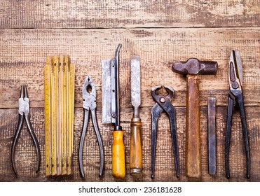 Old Tools On Wooden Background