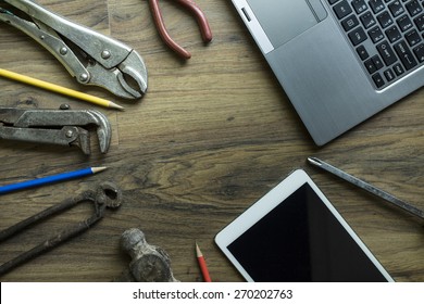 Old Tools , Tablet, Computer On A Wooden Table