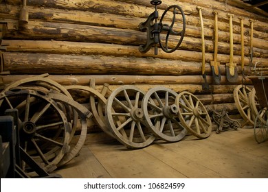 Old Tools And Wheels In A Barn