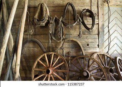 Old tools and wheels in a barn