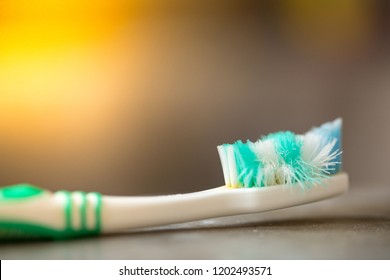 Old Toothbrush On Cement Floor