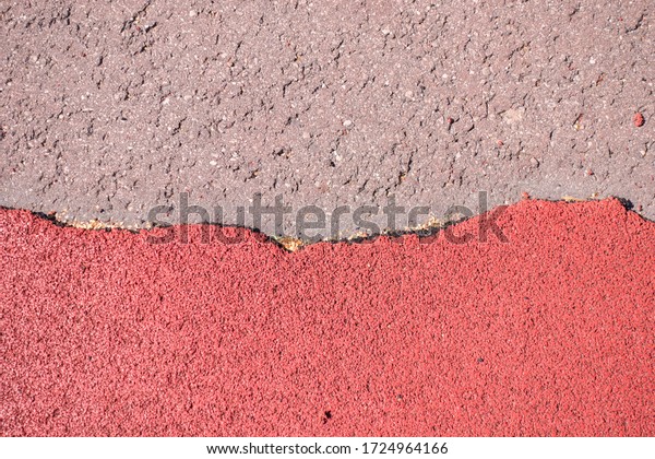 Old torn
red rubber crumb cover, treadmill or running track surface outdoor
playground stadium texture
background.