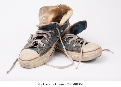 Old & Torn Shoes Isolated On White Background