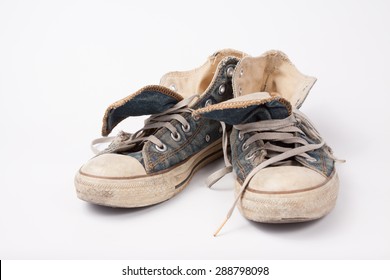 Old & Torn Shoes Isolated On White Background