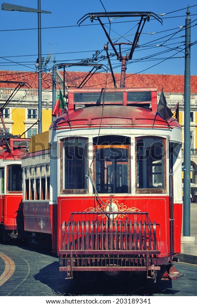 Old touristic tramway at the Commerce Square in\
Lisbon, Portugal
