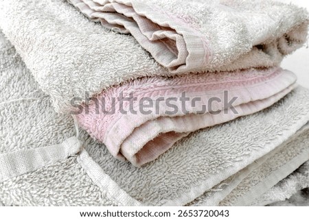 Old towel texture background. Pulled threads on towel. How to care for your bath towels concept.