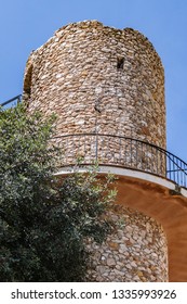 Old tower at the top of a small hill near Museum of Miniatures at Avenida del Compas. Mijas, Malaga, Costa del Sol, Andalusia, Spain. Mijas - Spanish hill town, known for its white-washed buildings.