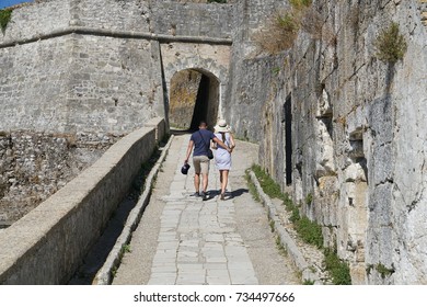 Old Town Of Corfu, Greece - JULY 30, 2017: Young Couple Walking At The Old Fortress Of Corfu Town