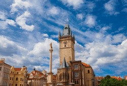 Old Town Hall Medieval Clock Tower Among Clouds In Prague, A City Landmark Erected In 1364 In Old Town Square, With Marian Column