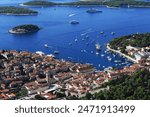 Old town of Hvar (Riva) with cathedral, boats and people, Hvar, Dalmatia, Croatia.