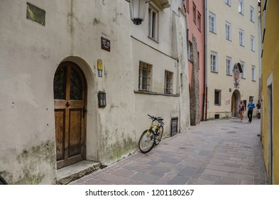 Old Town of Innsbruck, Austria-August 24, 2013: Narrow, winding, cobble stones paved streets between preserved, medieval houses attract  tourists because of their special charm