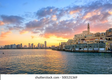 Old town of Jaffa and the modern skyline of Tel Aviv city on sunrise, Israel