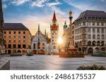 The old town of Munich, Germany, with Town Hall at the Marienplatz Square during a sunrise without people