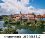 Old Town of Novo Mesto, in the Dolenjska region of Slovenia. Reflection of the colorful buildings in the Krka River