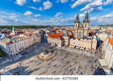 Old Town of Prague, Czech Republic. View on Tyn Church and Jan Hus Memorial on the square as seen from Old Town City Hall. Blue sunny sky