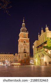 Old Town Square In Krakow At Night, Poland. St. Marys Basilica. Travel