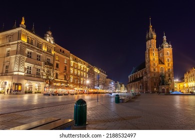 Old Town Square In Krakow At Night, Poland. St. Marys Basilica. Travel