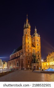 Old Town Square In Krakow At Night, Poland. St. Marys Basilica. Travel