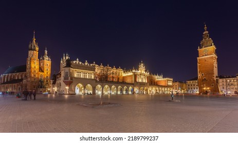 Old Town Square In Krakow At Night, Poland. St. Marys Basilica. Travel