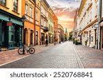 Old town street in Cracow, Poland at sunrise.