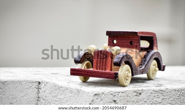 a old toy car made of\
wood