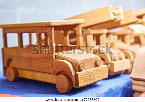 old toy cars made of\
wood. close-up