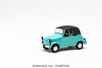 An old toy model of a retro car. Isolate on a white background - Shutterstock ID 2216871561