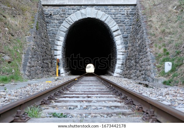 old-tracks-through-tunnel-600w-1673442178.jpg