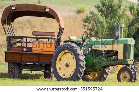 Old tractor with covered wagon