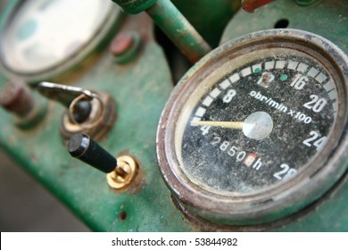 Old Tractor Dashboard With A Key In The Ignition