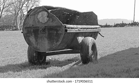 Old Tractor Muck Spreader On A Farm In Ireland