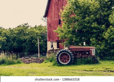 Old Tractor with red barn