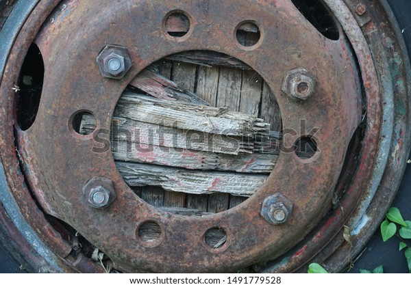 old tractor wheel hub\
with broken wood
